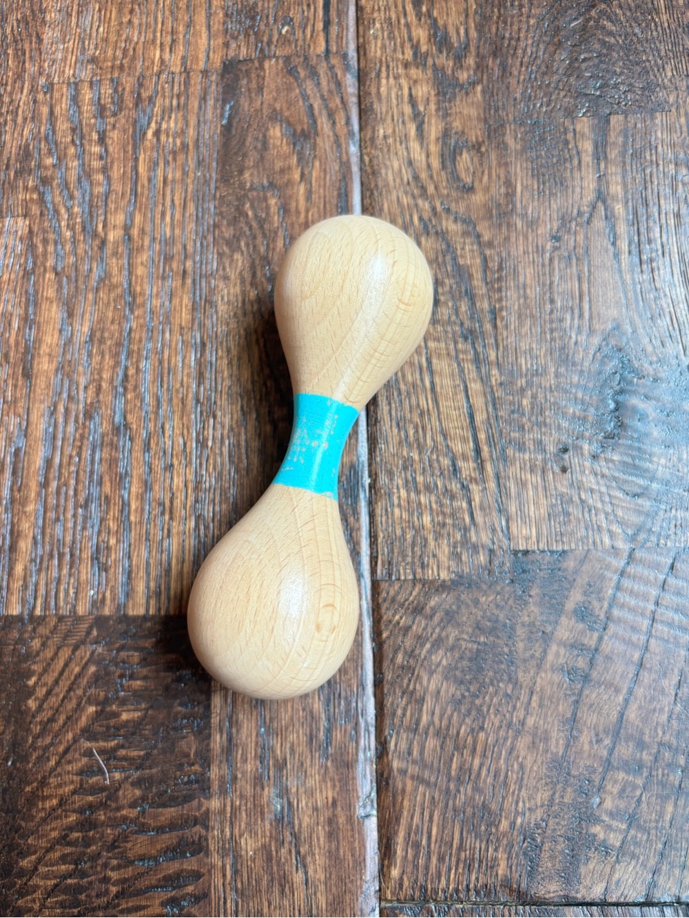 Lovevery wooden rattle from the charmer play kit
